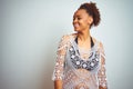 Young african american woman with afro hair wearing a bikini over white  background looking away to side with smile on Royalty Free Stock Photo