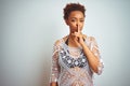 Young african american woman with afro hair wearing a bikini over white isolated background asking to be quiet with finger on lips Royalty Free Stock Photo