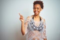 Young african american woman with afro hair wearing a bikini over white isolated background with a big smile on face, pointing Royalty Free Stock Photo