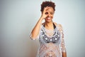 Young african american woman with afro hair wearing a bikini over white isolated background doing ok gesture with hand smiling, Royalty Free Stock Photo