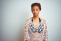 Young african american woman with afro hair wearing a bikini over white isolated background Relaxed with serious expression on Royalty Free Stock Photo