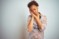 Young african american woman with afro hair wearing a bikini over white isolated background sleeping tired dreaming and posing Royalty Free Stock Photo