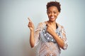 Young african american woman with afro hair wearing a bikini over white isolated background smiling and looking at the camera Royalty Free Stock Photo