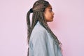 Young african american woman with braids wearing business jacket looking to side, relax profile pose with natural face with Royalty Free Stock Photo