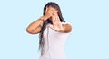 Young african american woman with braids wearing casual clothes covering eyes with hands and doing stop gesture with sad and fear Royalty Free Stock Photo