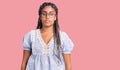 Young african american woman with braids wearing casual summer clothes and glasses relaxed with serious expression on face Royalty Free Stock Photo