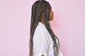 Young african american woman with braids wearing casual summer shirt looking to side, relax profile pose with natural face with Royalty Free Stock Photo