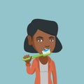 Young african-american woman brushing teeth.