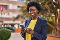 Young african american woman business executive using smartphone at park Royalty Free Stock Photo