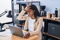 Young african american woman business worker suffering for headache working at office Royalty Free Stock Photo