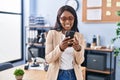 Young african american woman business worker using smartphone at office Royalty Free Stock Photo