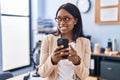 Young african american woman business worker using smartphone at office Royalty Free Stock Photo