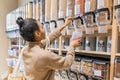 Young african american woman buying cereals and grains in sustainable grocery store Royalty Free Stock Photo