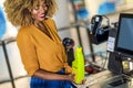 African American Woman buying food at grocery store or supermarket self-checkout Royalty Free Stock Photo