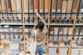 Young african american woman buying organic cereals and grains in sustainable zero waste grocery store. Rear view Royalty Free Stock Photo