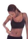 Young African American woman checking tummy fat Royalty Free Stock Photo