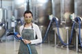 Young African-American Woman Cleaning Workshop at Factory Royalty Free Stock Photo