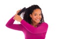 Young african american woman combing hair