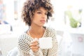 Young african american woman drinking coffee. Royalty Free Stock Photo