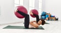 Young african american woman and hispanic man exercising at pilates room, stretching body and doing yoga pose, training strength Royalty Free Stock Photo