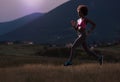 Young African american woman jogging in nature