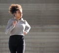 Young african american woman jogging outdoors Royalty Free Stock Photo