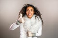 Young african american woman in knitted mittens warm sweater and deer horns Royalty Free Stock Photo