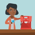 Young african-american woman making coffee. Royalty Free Stock Photo