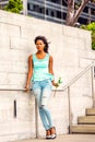 Young African American Woman missing you with white rose in New Royalty Free Stock Photo