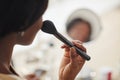 Young African-American Woman Putting On Blush Royalty Free Stock Photo