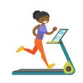 Young african-american woman running on treadmill. Royalty Free Stock Photo