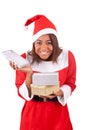 Young african american woman with santa hat and gifts