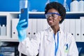 Young african american woman scientist make selfie by the smartphone at laboratory