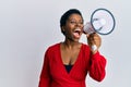 Young african american woman screaming angry using megaphone over isolated white background Royalty Free Stock Photo