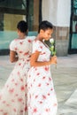 Young African American Woman holding white rose, thinking you by Royalty Free Stock Photo