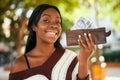 Young african american woman smiling happy holding leather wallet with south africa rands at the park Royalty Free Stock Photo