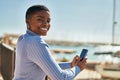 Young african american woman smiling happy using smartphone at the port Royalty Free Stock Photo