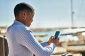 Young african american woman smiling happy using smartphone at the port Royalty Free Stock Photo