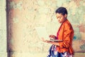 Young African American Woman studying, working on laptop computer outside in New York