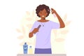Young african american woman takes care of her hair, applying moisturizing spray to curly hair Royalty Free Stock Photo