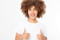 Young african american woman in template blank t shirt showing big thumb up isolated on white background. Afro curly hair. Royalty Free Stock Photo