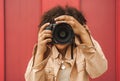 young african american woman using digital camera