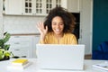 Young African-American woman using laptop at home Royalty Free Stock Photo