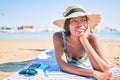 Young african american woman on vacation smiling happy laying on the towel at the beach