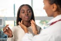 Young African American woman visiting endocrinologist