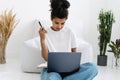 Young african american woman watching online lecture on laptop Royalty Free Stock Photo