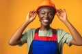 Young african american woman wearing architect hardhat against yellow background Royalty Free Stock Photo