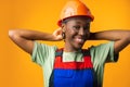 Young african american woman wearing architect hardhat against yellow background Royalty Free Stock Photo