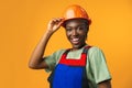 Young african american woman wearing architect hardhat against yellow background Royalty Free Stock Photo