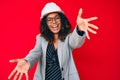 Young african american woman wearing architect hardhat looking at the camera smiling with open arms for hug Royalty Free Stock Photo